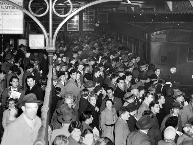 The peak hour crush at Flinders Street Station in 1955. Flinders Street was once the busiest station in the world. Picture: HWT Library.