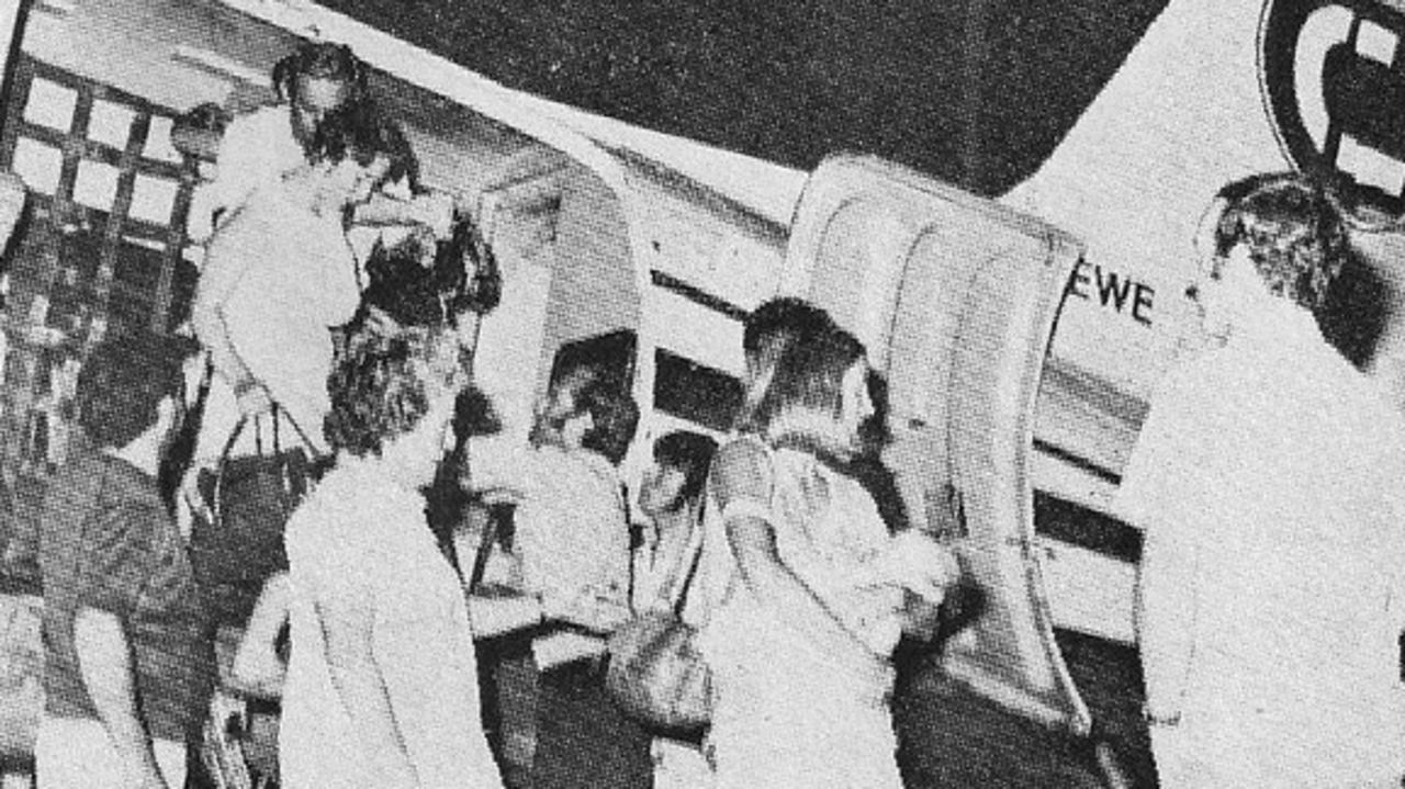 A newspaper clipping of the first evacuees arriving in Alice Springs after Cyclone Tracy, December 1974.