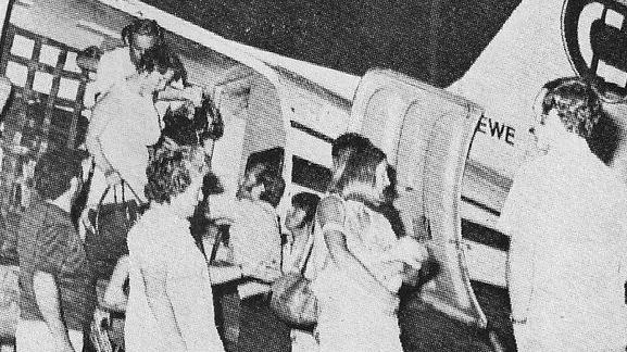 A newspaper clipping of the first evacuees arriving in Alice Springs after Cyclone Tracy, December 1974.