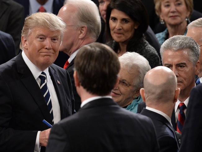 President Trump departs after making his address.