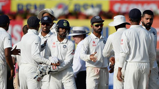 Indian team players shake hands with each other after the fifth day of the third cricket Test match between India and Australia at the Jharkhand State Cricket Association (JSCA) Stadium complex in Ranchi on March 20, 2017. ----IMAGE RESTRICTED TO EDITORIAL USE - STRICTLY NO COMMERCIAL USE----- / GETTYOUT---- / AFP PHOTO / SAJJAD HUSSAIN / ----IMAGE RESTRICTED TO EDITORIAL USE - STRICTLY NO COMMERCIAL USE----- / GETTYOUT