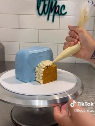 The cake is then carved and covered in icing. Picture: TikTok