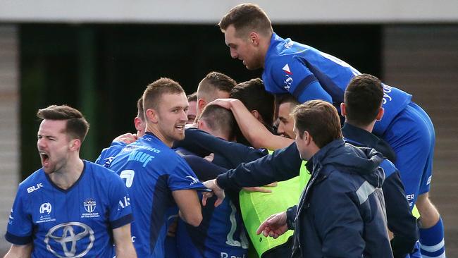 South Melbourne players celebrate a goal against Oakleigh Cannons in the NPL Victoria grand final on Sunday night.