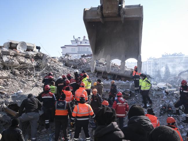 Rescue teams, firemen and volunteers work on a collapsed building to evacuate a victim in Elbistan, Turkey. Picture: Getty