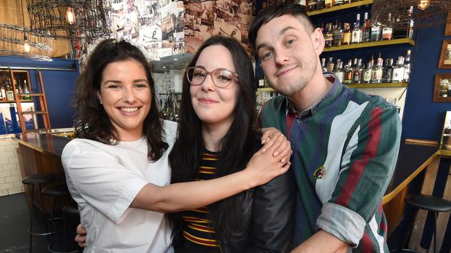 Sarah Harrison (centre), with Sarah McSparron and Lewis Hall, who helped save her life when she had a sudden cardiac arrest at a Fitzroy bar. Picture: Tony Gough