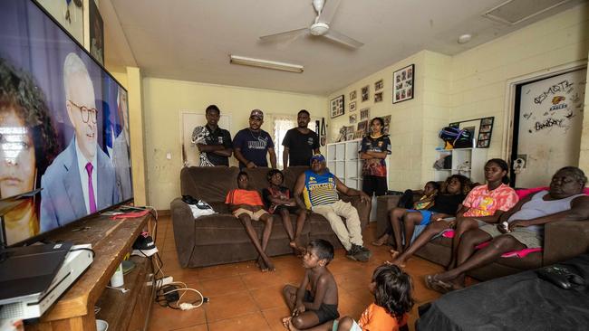 You’re the voice: Phillip Goodman and his family watch Anthony Albanese on television announce the wording for the voice constitution from their home at 15 Mile Community on the outskirts of Darwin. Picture: Liam Mendes