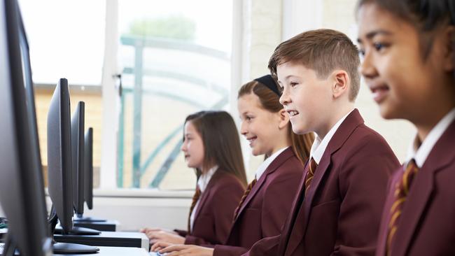 QST - Schools of excellence feature - generic school pic - pupils enjoying computer class