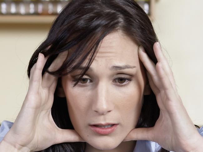 Worried Mid-Adult Woman Using Laptop