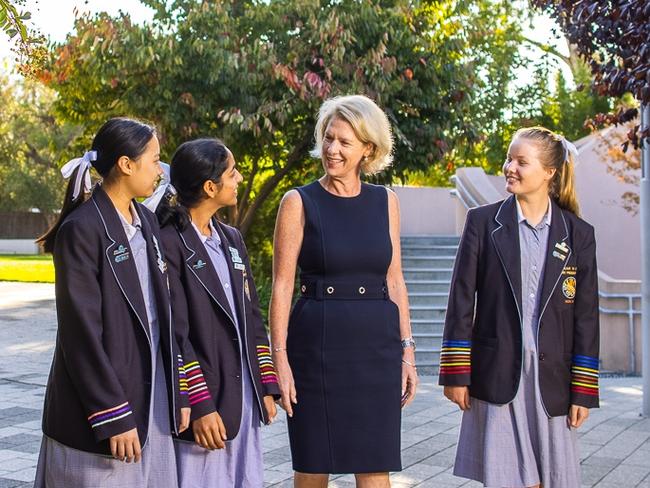 Jane Danvers, principal of Wilderness School, Adelaide from 2006 to 2021.Pictured with students Tiffany, Ishani and Ella. Ms Davers has beenappointed principal of Kambala, Sydney. Picture supplied June 2021 byWilderness School