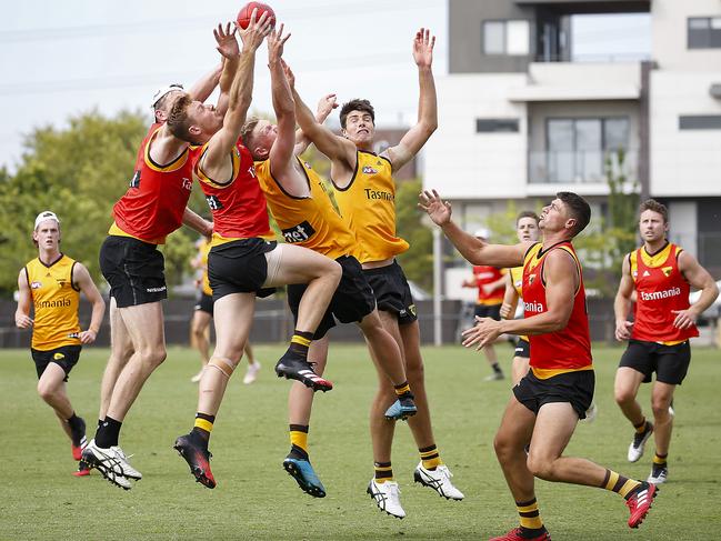 The pack flies during match simulation at Hawthorn training. Picture: Ian Currie