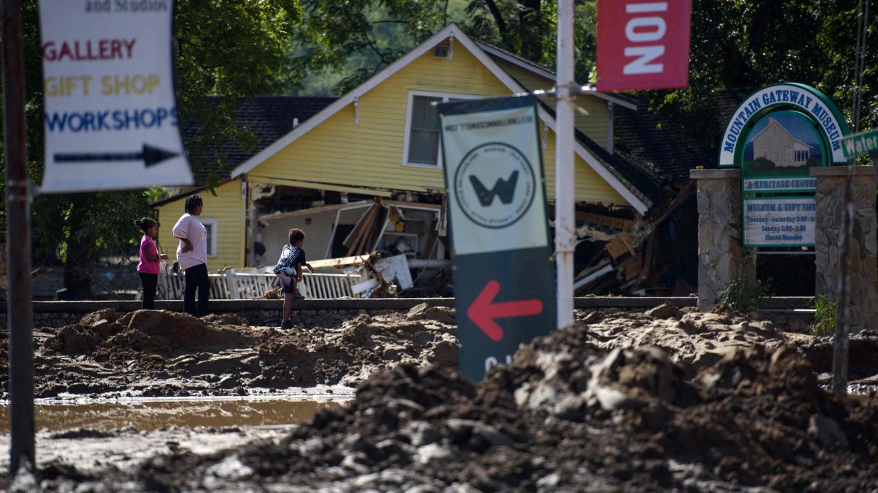 Close to 2 million households and businesses are still without power and damaged roads are making it impossible for rescue crews to access some areas. Picture: Getty Images via AFP