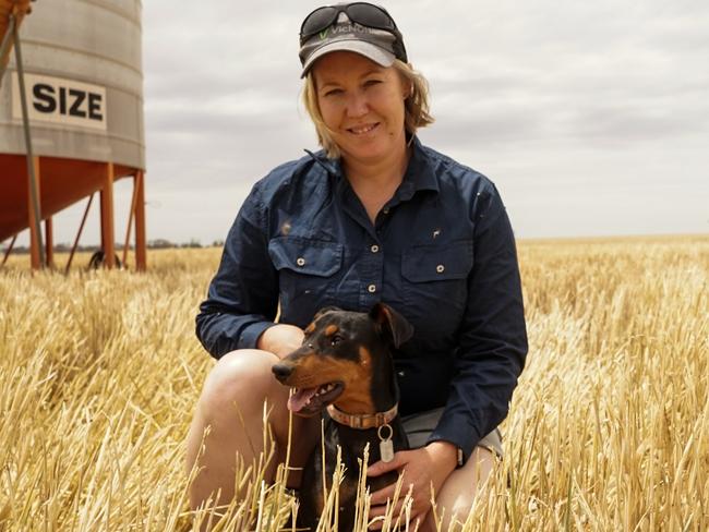 Waitchie farmer Carol Fitzpatrick with her Kelpie Jess, amid the start of the 2024 harvest. Picture: Rachel Simmonds