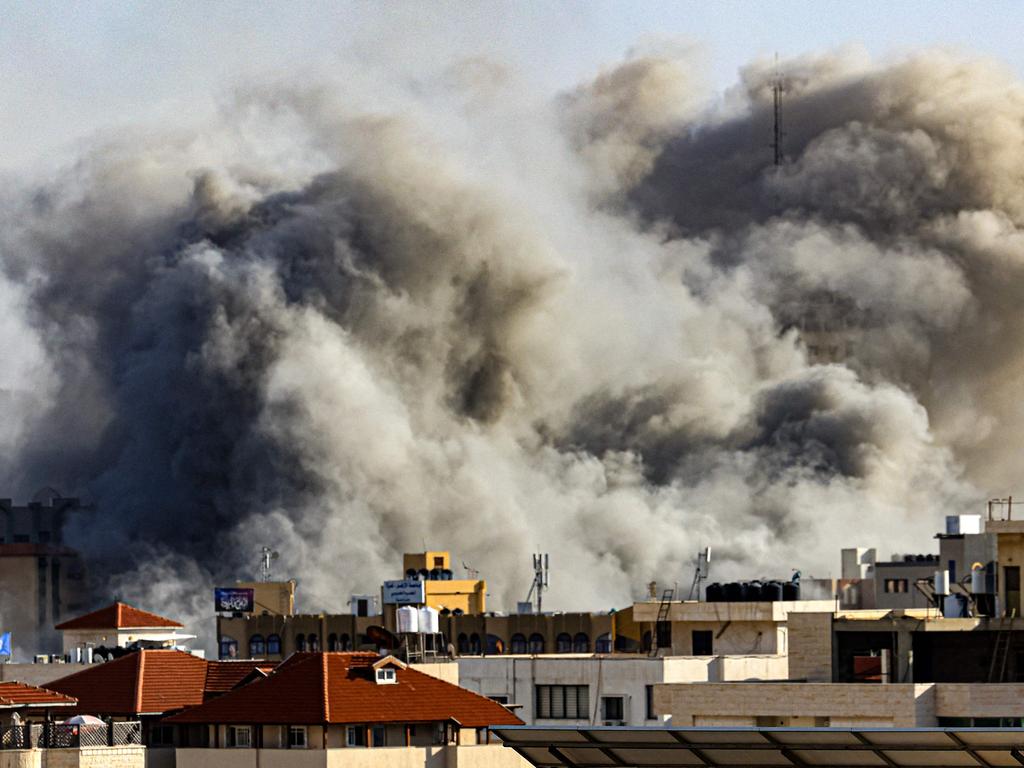 Smoke plumes rise over Gaza City during Israeli air strikes. Picture: AFP