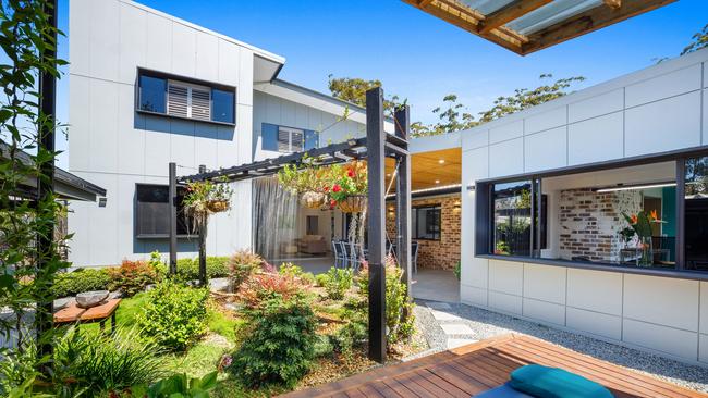 City meets country in this chic home on Tamborine Mountain in the Gold Coast Hinterland that has been designed for sustainable dual living. The backyard has a custom, raised yoga platform where you can breathe in the mountain air during morning sun salutations, surrounded by carefully cultivated vegetable and herb gardens as well as fruit trees. Take your pick from the property’s homegrown harvest of blueberries, mandarins, acerola cherries, lemons, pomegranate, plums, guava, apricot and herbs including sage, echinacea, rosemary and more. There’s also a contemporary waterfall feature and cubby house for the little ones.