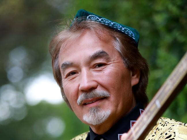 Traditional performer Shohrat Tursun poses for photographs with his Dutar in Parramatta. Parramatta, Thursday, August 23rd 2018. The Uyghur people are a Turkic ethnic group who live in East and Central Asia UNESCO protected song cycle, Muqam Rak, will be performed at the Riverside Theatres for the Sydney Sacred Music Festival. (AAP Image / Angelo Velardo)