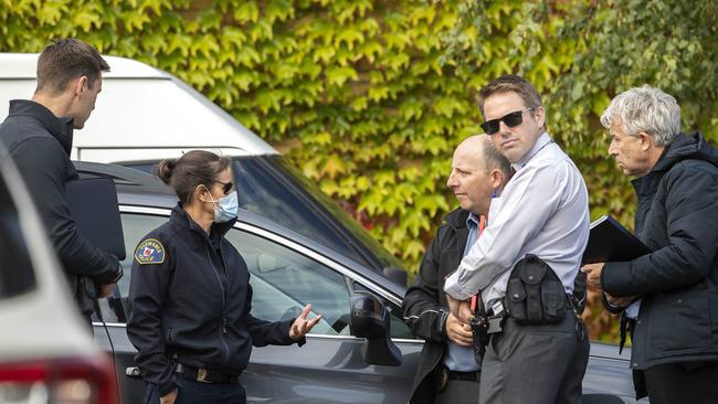 Police at the scene in Harrington St where a man was found dead. Picture: Chris Kidd