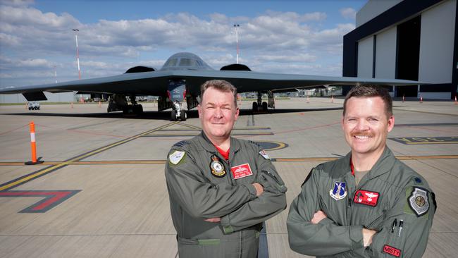 Group Captain Paul Jarvis and USAF Lieutenant-Colonel Justin Meyer in front of B-2 Spirit stealth bomber ‘Spirit of Indiana’ at Amberley. Picture: Steve Pohlner