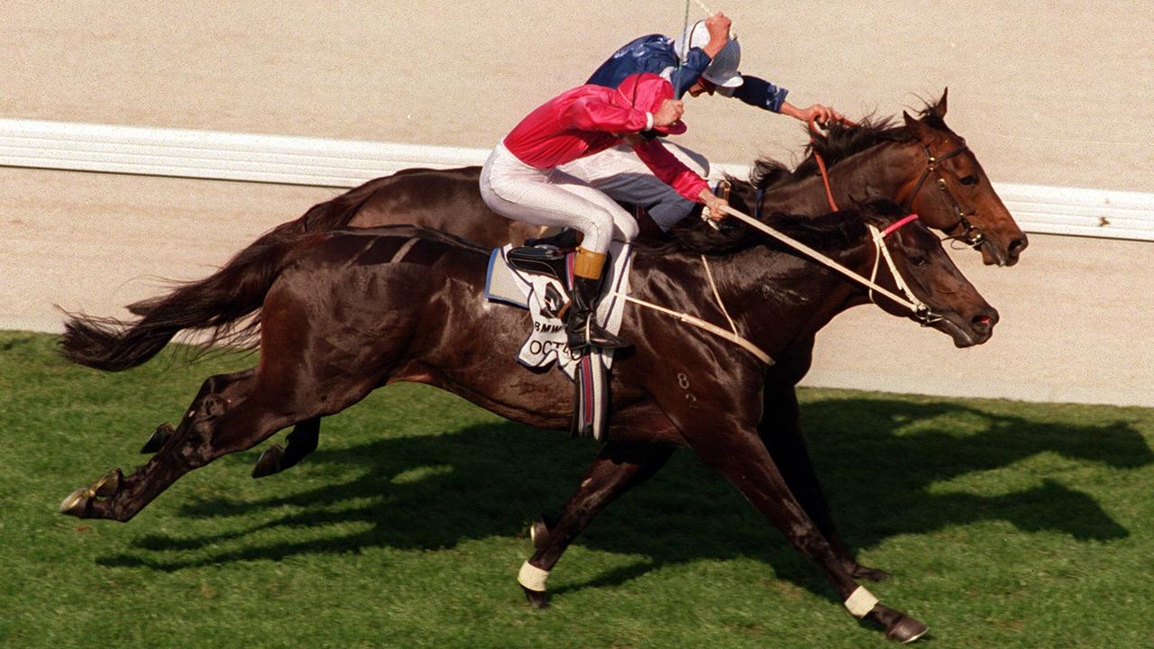 Horseracing - racehorse Octagonal ridden by jockey Shane Dye goes to the line to just win from Mahogany (rails) ridden by Greg Hall in the finish of the Cox Plate race.