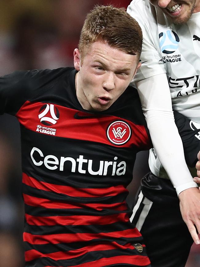 and Daniel Wilmering handed out the jerseys for Nepean FC’s Skills Acquisition Program teams. Pictures: Getty and AAP