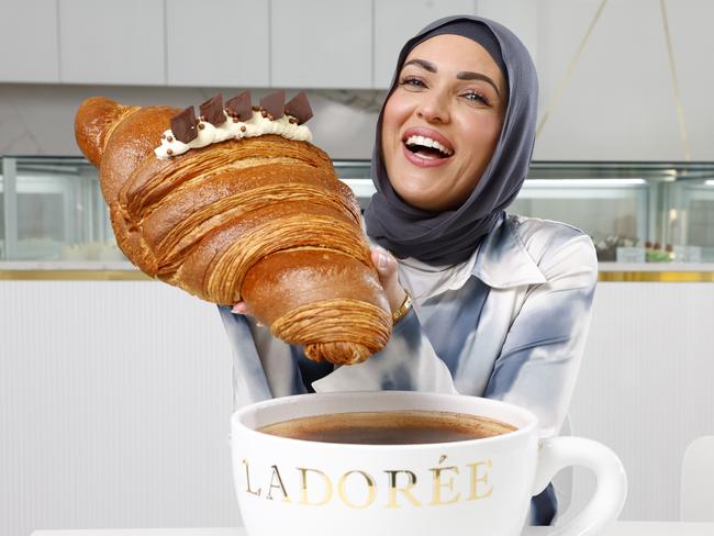 DAILY TELEGRAPH MARCH 7, 2024, HOLD FOR KC. New Greenacre cafe La Doree has launched a giant croissant and 6L coffee which cost $110. Naaila Dalati with the croissant that takes three days to make. Picture: Jonathan Ng