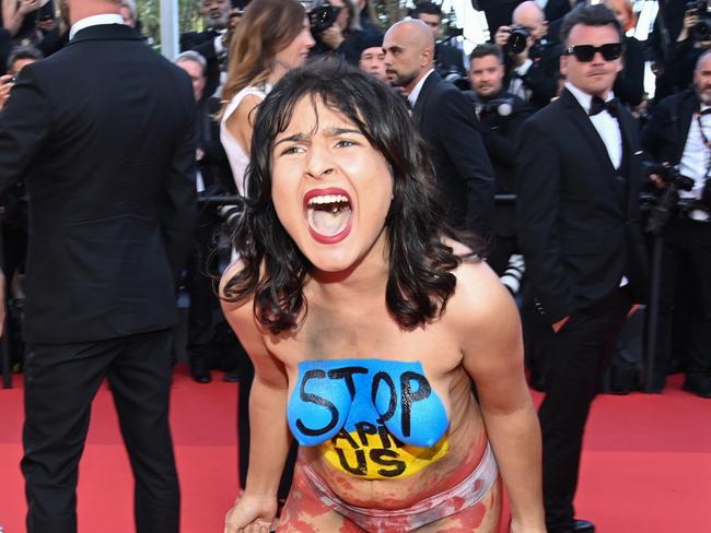 Topless protester crashes red carpet