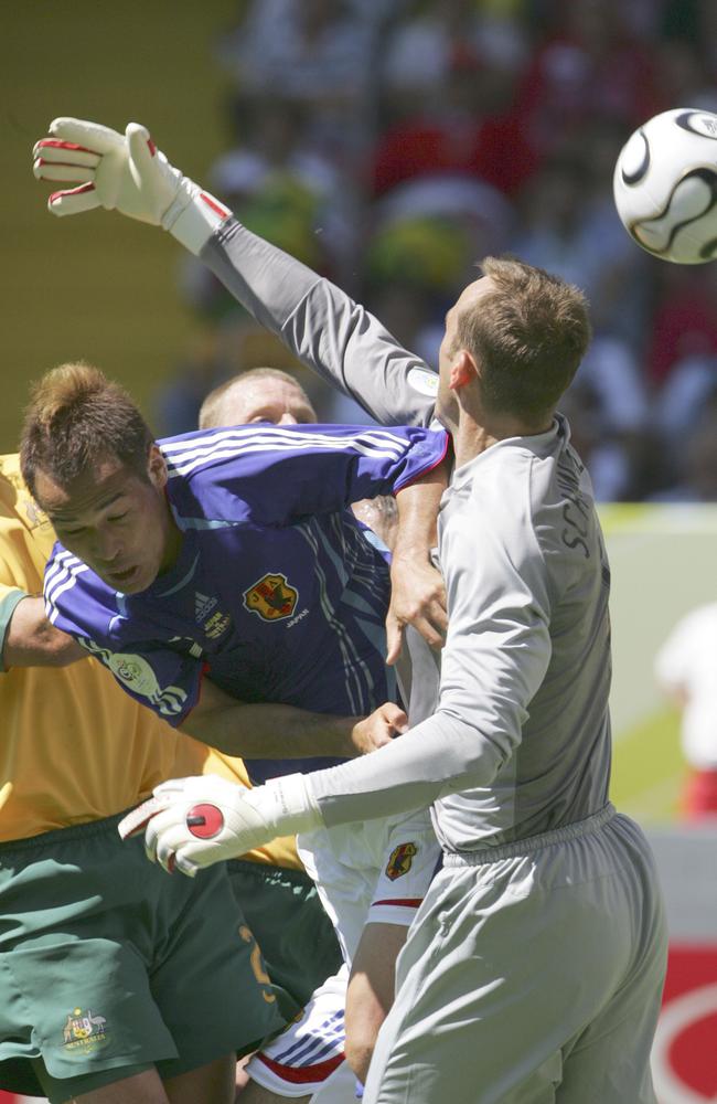 Shunsuke Nakamura denies Mark Schwarzer a fair chance to defend a goal. In fairness, though, Australia should have conceded a penalty later through Tim Cahill which the ref somehow overlooked.