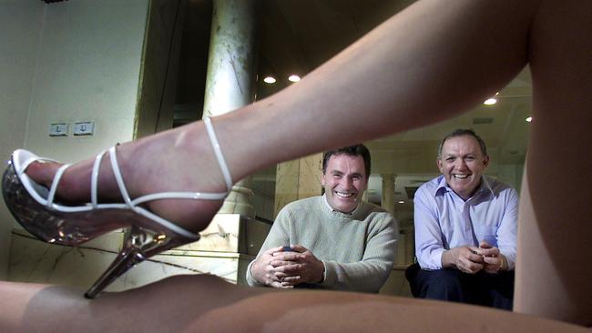 Daily Planet brothel founders, CEO Andrew Harris (left) and chairman John Trimble (right) with a girl at the Melbourne bordello, which is on sale for $7m. Picture: News Corp.