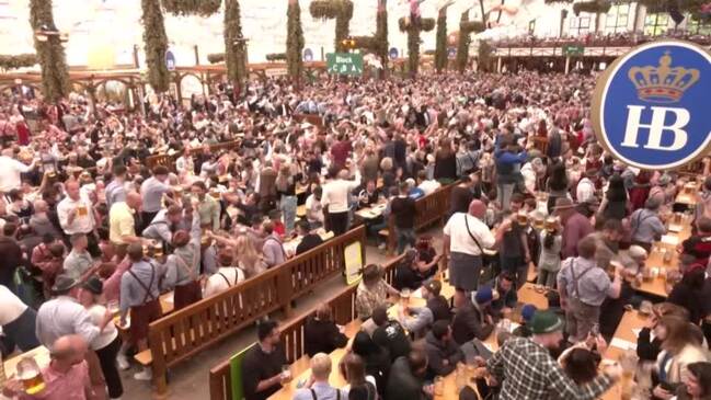 Oktoberfest beer-drinkers celebrate half time