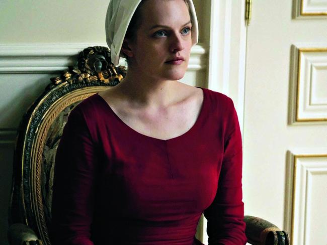 TWAM-20170805 EMBARGO FOR TWAM 5 AUG 2017This image released by Hulu shows Elisabeth Moss as Offred in a scene from, "The Handmaid's Tale." The program was nominated for an Emmy Award for outstanding drama series on Thursday, July 13, 2017. The Emmy Awards ceremony, airing Sept. 17 on CBS, will be hosted by Stephen Colbert. (George Kraychyk/Hulu via AP)