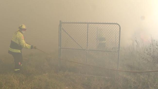 A firefighter tackles the blaze in Sydney’s southwest. Picture: TNV