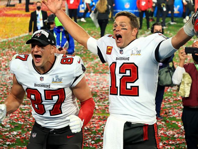 TAMPA, FLORIDA - FEBRUARY 07: Rob Gronkowski #87 and Tom Brady #12 of the Tampa Bay Buccaneers celebrate after defeating the Kansas City Chiefs in Super Bowl LV at Raymond James Stadium on February 07, 2021 in Tampa, Florida. The Buccaneers defeated the Chiefs 31-9.   Mike Ehrmann/Getty Images/AFP (Photo by Mike Ehrmann / GETTY IMAGES NORTH AMERICA / AFP)