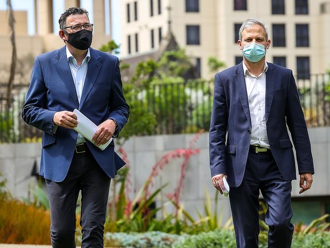 Premier Dan Andrews and chief health officer Brett Sutton arrive at the press conference on Melbourne’s first day of freedom. Picture: Ian Currie