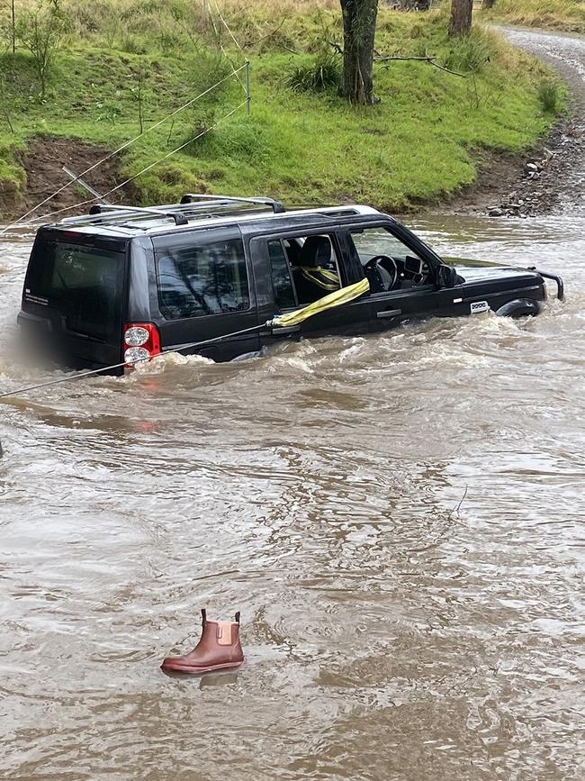 The stranded vehicle was left in a precarious position. Picture: NSW Police.