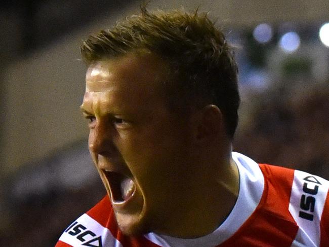 WIGAN, ENGLAND - FEBRUARY 17:  Brett Morris of Sydney Roosters celebrates as he scores their first try during the World Club Challenge match between Wigan Warriors and Sydney Roosters at DW Stadium on February 17, 2019 in Wigan, England. (Photo by Nathan Stirk/Getty Images)