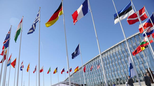 Finland's flag is added officially at the NATO headquarters in Brussels. Picture: AFP