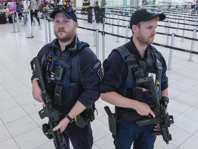 ADELAIDE, AUSTRALIA - NewsWire Photos DECEMBER 18 2023:  AFP AIRPORT PATROL. Protective Service Officer Grade 1 Patrick Barry and Protective service officer Brendan Bates.Picture: NCA NewsWire / Roy VanDerVegt