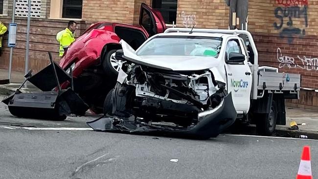 Emergency services at the scene of a crash on Denison St, Hamilton. Picture: Dan Proudman