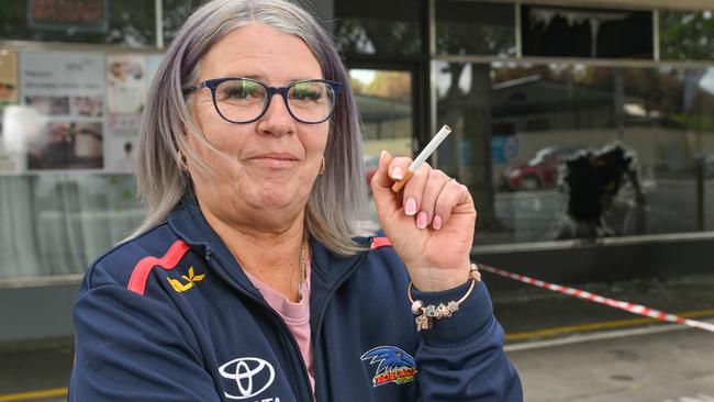 Adelaide resident Sharon van Homelen near the recently firebombed shop on Sir Donald Bradman Drive at Cowandilla where she brought cigarettes. Picture: Brenton Edwards