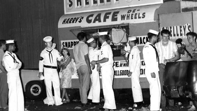 Visiting US sailors at Harry Cafe de Wheels, outside Garden Island Naval Dockyard, Woolloomooloo, Australia in 1988.