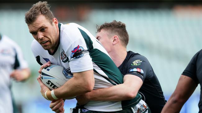 St Marys Tom Eisenhuth charges at the Mounties defence during the grand final of the Ron Massey Cup at Pirtek stadium.