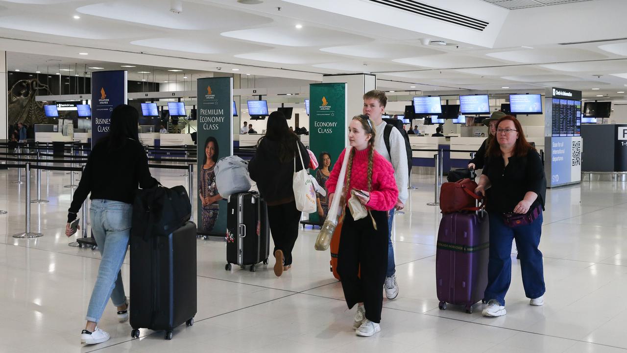 SYDNEY, AUSTRALIA - NewsWire Photos - MAY 22, 2024: A general view of people walking past the Singapore Airlines check in counters at Sydney International Airport. Picture: NewsWire / Gaye Gerard