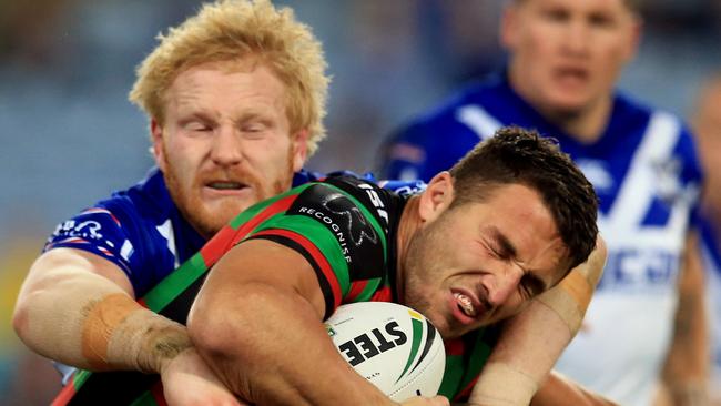 Sam Burgess of Souths tackled by James Graham of the Bulldogs during the Canterbury Bulldogs v South Sydney Rabbitohs round 26 NRL game at ANZ Stadium. pic Mark Evans