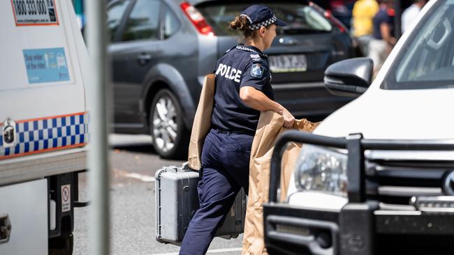 Police remove bags from Cairns Central Shopping Centre. Picture: Emily Barker.