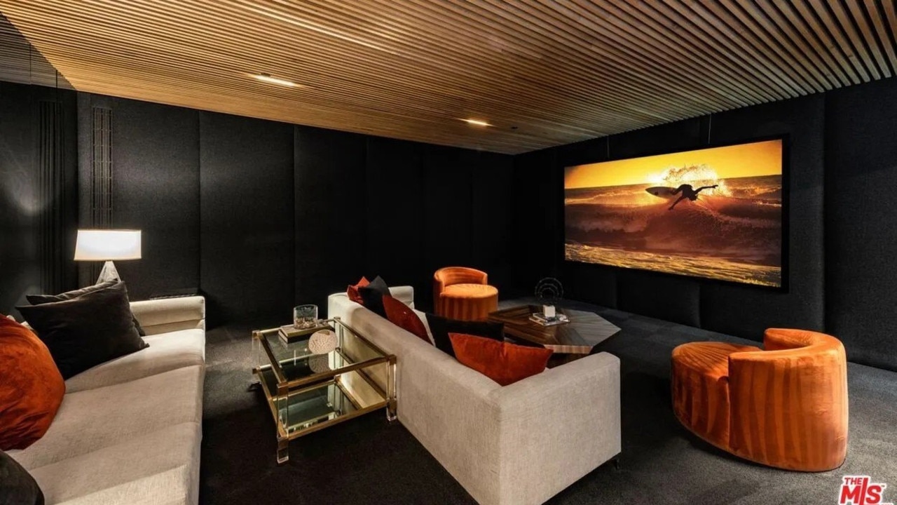 Plush couches galore in the home cinema room. Picture: Realtor.com