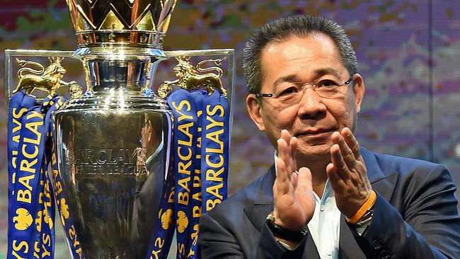 (FILES) In this file photo taken on May 18, 2016 Leicester City FC's owner Vichai Srivaddhanaprabha applauds as they take part in a presentation of the English Premier League football trophy at the King Power duty-free headquarters in Bangkok on May 18, 2016. - A helicopter belonging to Thai tycoon Vichai Srivaddhanaprabha crashed on October 27, 2018 near the stadium of his UK football club Leicester City. The identities of the pilot and any passengers on board have not yet been confirmed. It is also not yet known if anyone on the ground was injured. (Photo by CHRISTOPHE ARCHAMBAULT / AFP)