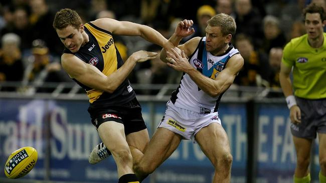 Daniel Jackson fends off Kane Cornes in 2014. Picture: Tim Carrafa