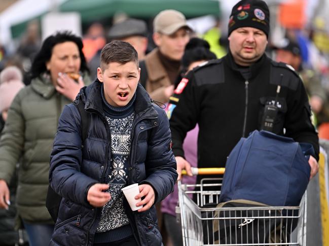 People, mostly women and children, cross from war-torn Ukraine into Poland in Medyka, Poland. Picture: Getty Images