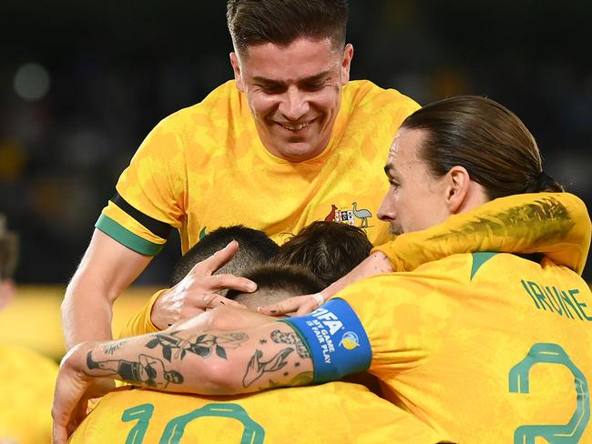 MELBOURNE, AUSTRALIA - MARCH 28: Brandon Borrello of the Socceroos is congratulated by team mates after scoring a goal during the International Friendly match between the Australia Socceroos and Ecuador at Marvel Stadium on March 28, 2023 in Melbourne, Australia. (Photo by Quinn Rooney/Getty Images)