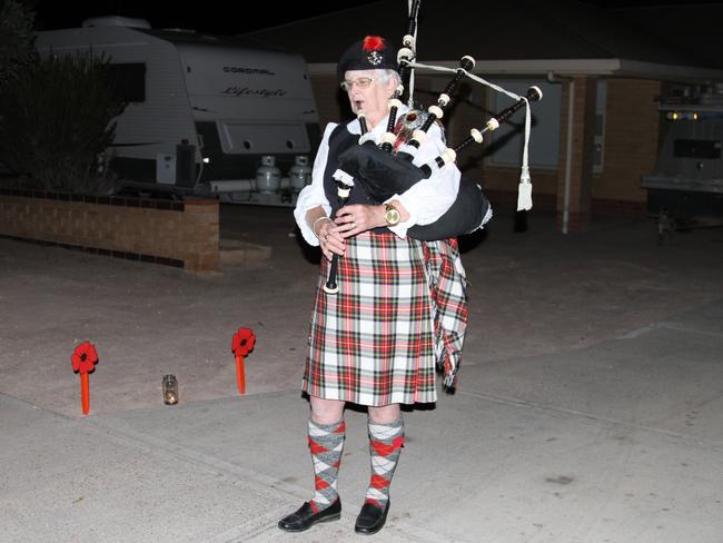 Ceduna woman Cheryl Ross playing the bag pipes at 6am. The dawn was so calm and quiet that her music could be heard right across the town. Picture: Andrew brooks