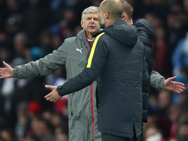 Arsene Wenger, Manager of Arsenal (L) argues with Pep Guardiola.